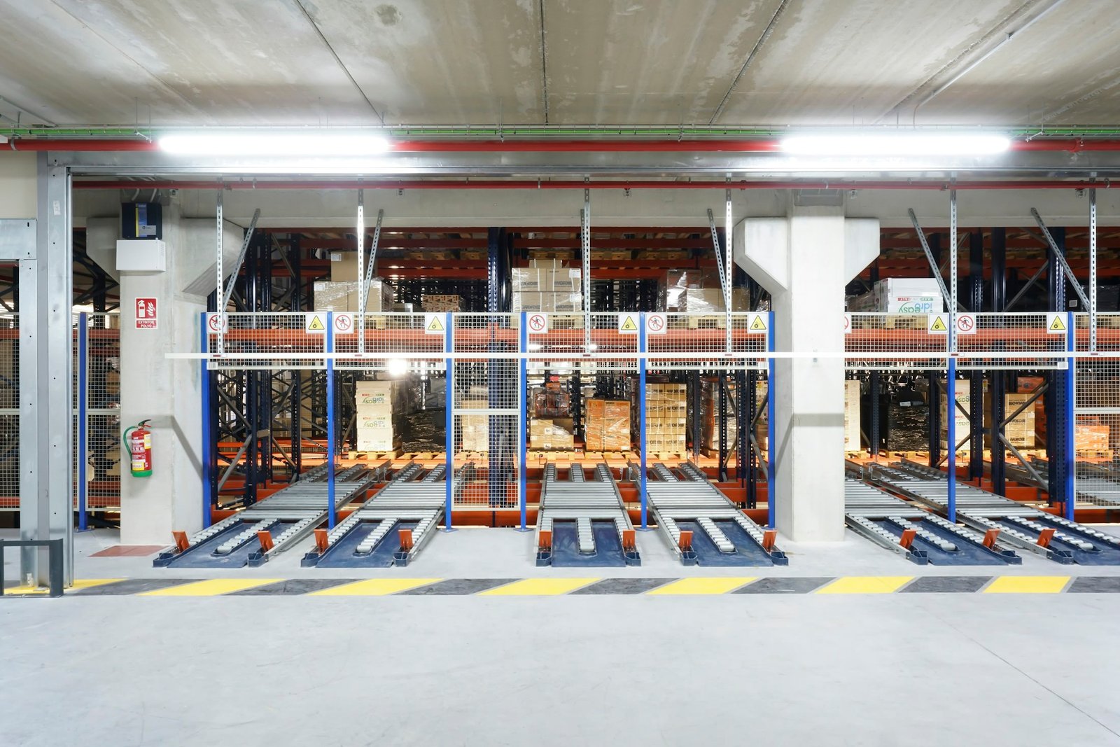 A working warehouse system holding organized goods and pallets